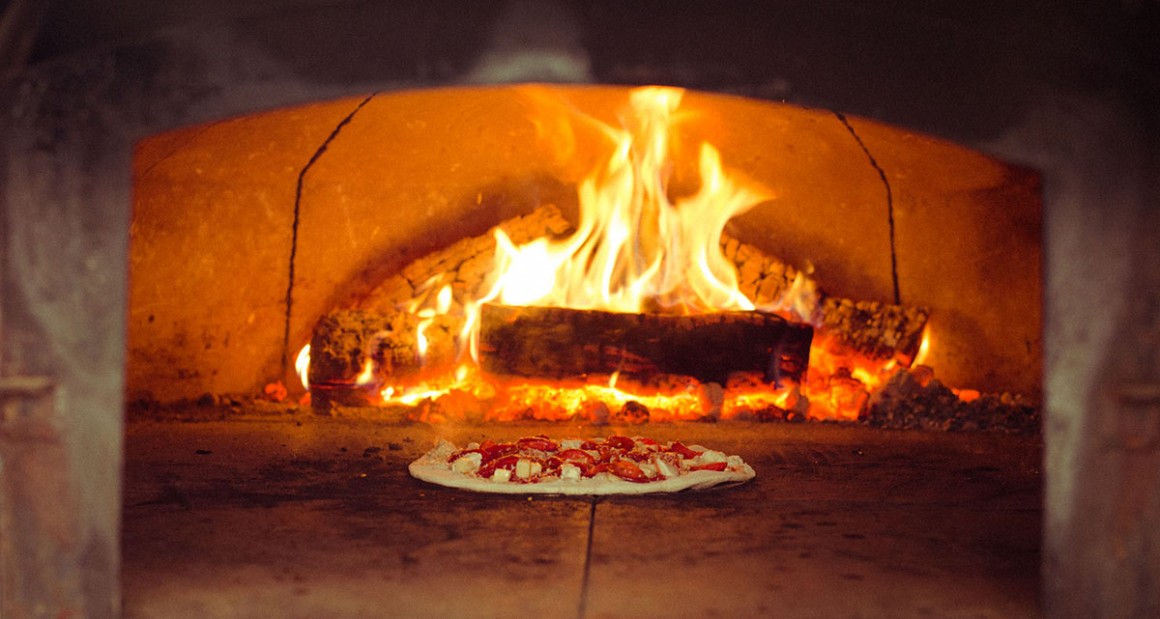 Pizza being fired in the oven. Photograph by William Hereford