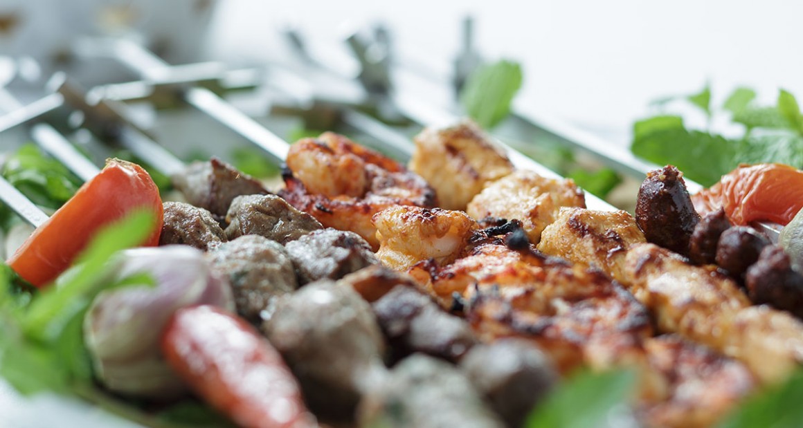A mixed grill of shrimp, lamb, beef, and chicken. Photograph by Walter Shintani.