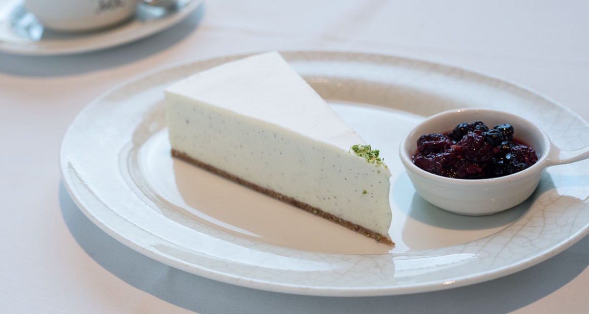 A creamy slice of vanilla-flecked cheesecake. Photograph by Walter Shintani.