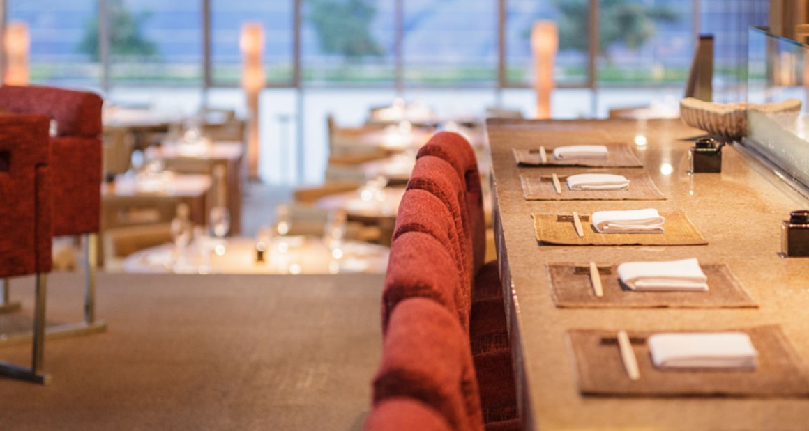 Take a seat at the sushi bar. Photograph by Walter Shintani.